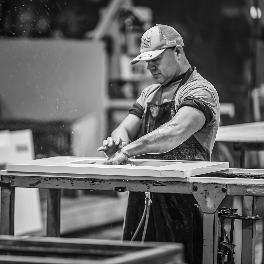 Carolina Custom Kitchen workers polishing stone slabs